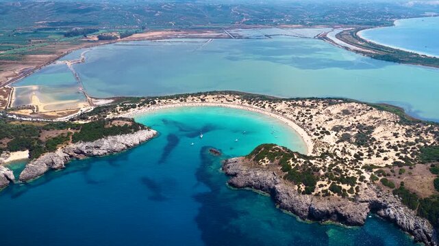 Panoramic aerial view of the popular Voidokilia beach in Messinia, Peloponnese, Greece, situated in a lgaoon with sand dunes and turquoise sea