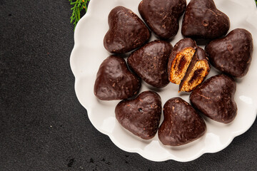 Gingerbread chocolate heart shaped honey cakes Christmas sweet dessert new year natural product tasty snack fresh delicious gourmet food background on the table rustic top view copy space