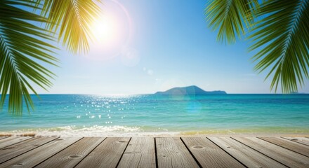 Idyllic tropical beach scene with a wooden deck in the foreground, turquoise ocean, clear blue sky, and lush palm leaves framing the view