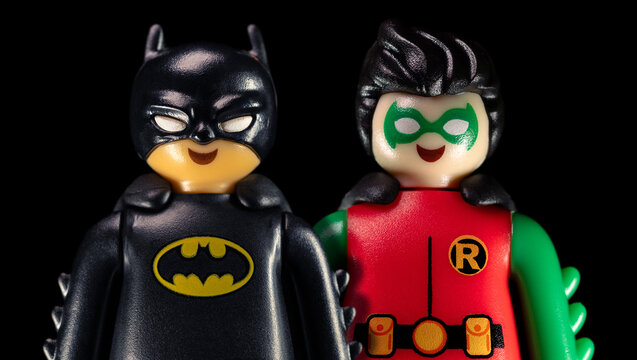 DC Batman and Robin standing on a black background