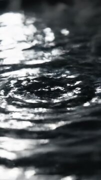 Extreme slow motion close-up of light refracting through a rippling, invisible distortion field like hot air over a clear surface modern design, surface tension, sleek