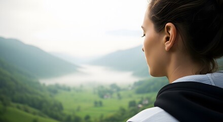 activewear greenery sunlight wellness, Contemplative woman gazes at a misty mountain valley in a peacef