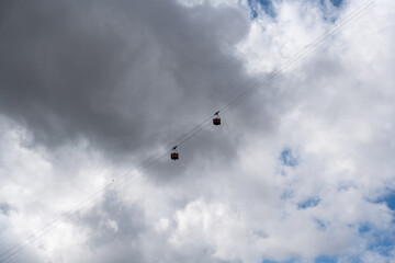 Ski lift gondola with cable cars meeting in the middle
