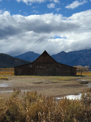 mountain landscape with house in the center of the field 