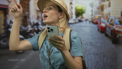 Woman holds smartphone on bustling cobblestone street with parked scooters and cars and pith helmet and backpack visible; adventure.