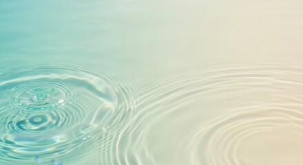 Gentle ripples on the surface of calm, clear water with a soft gradient of turquoise and beige colors, creating a serene and tranquil abstract background