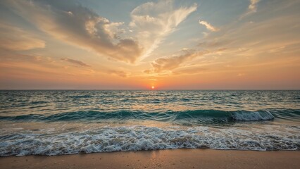 Fototapeta premium Sunset over the ocean with waves and a cloudy sky, capturing a beautiful evening by the sea.