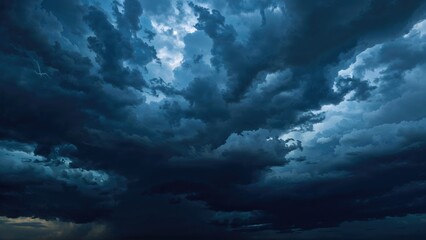 Obraz premium Dark storm clouds in the sky with a moody and dramatic atmosphere.