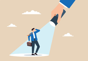 Businessman stands in bright spotlight, illustrating successful candidate for a job vacancy. Concept of outstanding performance, ambition, opportunities, and making ideal choice for job position
