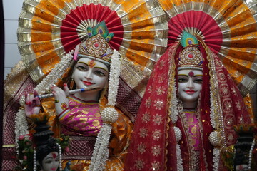 Traditional Radha Krishna Idols with Vibrant Festive Decorations