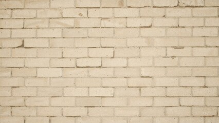 Fototapeta premium Light beige brick wall background with a subtle pattern.
