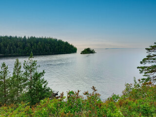 A beach with a body of water in the background.