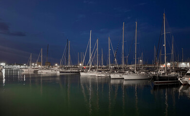 Night marina with sailing yacht