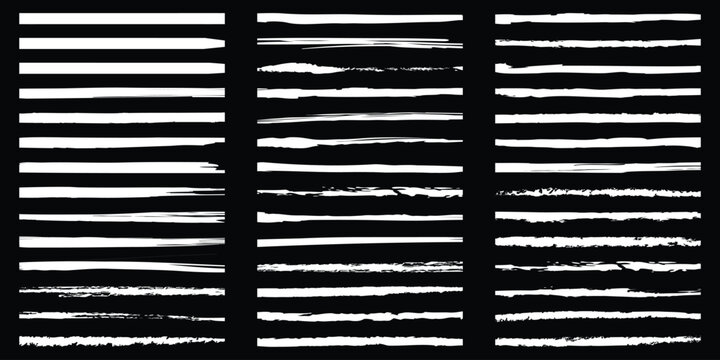 Collection of distressed grunge horizontal brush strokes set on black background