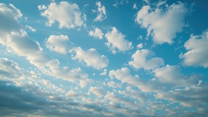 A sky filled with fluffy clouds on a bright day.