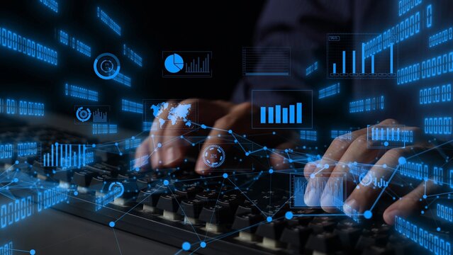 A close-up view of hands typing on a keyboard, highlighted by floating digital data visualizations and infographics that showcase technology and analytics concepts. Xenic - Powered by Adobe
