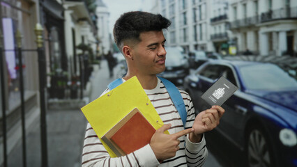 Man standing on city street holding canadian passport and pointing with a thoughtful expression, surrounded by buildings and cars, suggesting travel contemplation.
