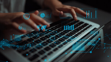 A close-up image of hands typing on a laptop, overlayed with digital data visualizations including charts and graphs, representing the intersection of technology and data analysis. Xenic