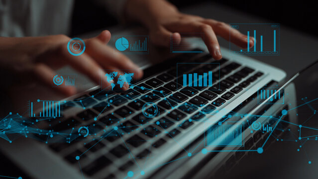 A close-up image of hands typing on a laptop, overlayed with digital data visualizations including charts and graphs, representing the intersection of technology and data analysis. Xenic - Powered by Adobe