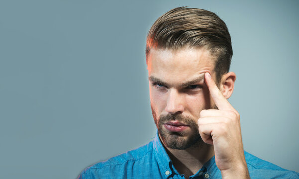 Thinking man. Pensive thoughtful man in denim shirt thinking about something. Serious guy in casual wear thinking about future, planning new startup. Handsome man with stylish hairstyle looking away.