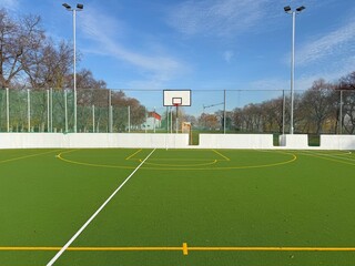 Basketball field with artificial green turf