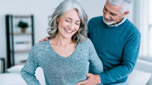 Happy senior woman feeling relief and joy during a professional chiropractic consultation, receiving gentle support and care for her back