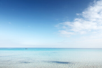 quil Turquoise Beach With Clear Water and Wide Blue Sky at Horizon