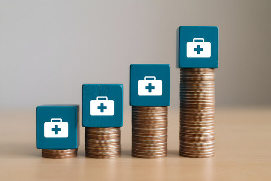 Rising healthcare costs depicted with stacked coins and medical kit blocks illustrating financial growth and investment in health services showing an upward trend in expenses