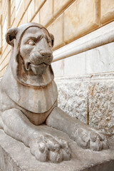 Stone Lion Statue Guarding Marble Steps By Historic Beige Building Facade Outdoor Sculpture