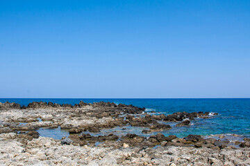 White limestone cliffs and an black sand beach near Governor s Beach, district of Larnaca, at the south coast of Cyprus