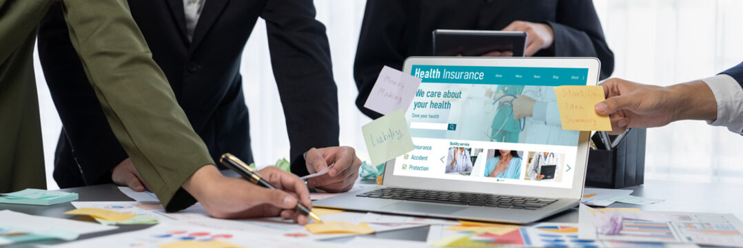 Analyst team use sticky note for creative and analytic brainstorm for business idea with BI data dashboard on laptop screen. Analysis financial data visualization tech for marketing strategy. Prodigy - Powered by Adobe