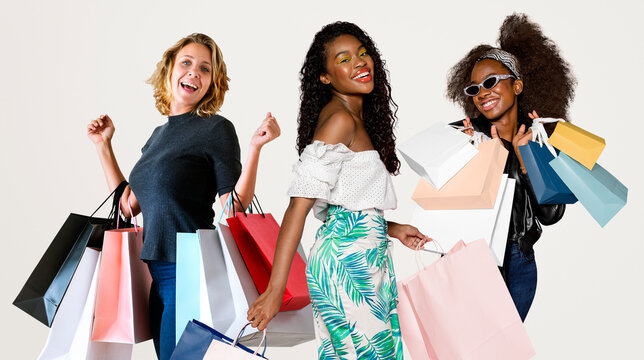 Women with shopping bags, isolated on off white - Powered by Adobe