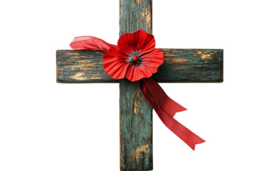 Memorial cross with red ribbon and poppy tied for remembrance and honoring the fallen