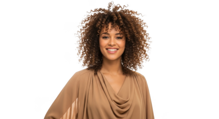 Smiling woman with voluminous curly hair wearing a flowing tan garment transparent background