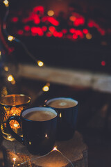 Holiday Drink: Still Life with Coffee, Wood Slice, and Festive Lights