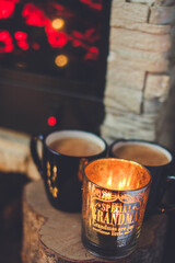 Warm Evening Mood: Two Mugs of Hot Drink and the Glow of a Candle