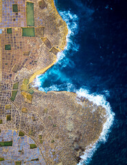 Explore the stunning salt pans of Gozo Malta by the vibrant blue coast