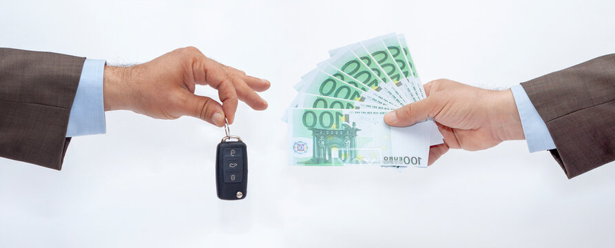 auto salesman hand and money