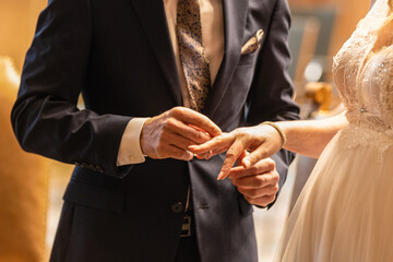 bride and groom hands in a wedding day.