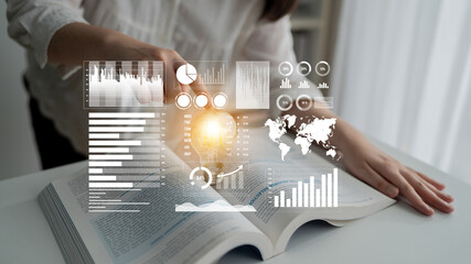 A person examines an open book while interactive data visuals overlay the scene, symbolizing the fusion of knowledge and data analysis for informed decision-making. Impute