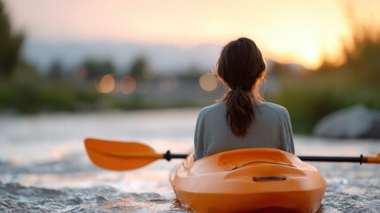 Kayaker enjoying serene sunset on calm water, surrounded by nature, reflecting tranquility and adventure in outdoor recreation experience