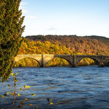 Autumn Colours Illuminated by the Sun at Dunkeld Bridge, Scotland