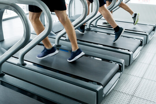 gym shot - people running on machines, treadmill with motion blur