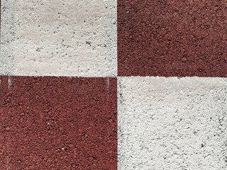 Fondo de textura con patr&oacute;n de cuadros o damero en colores blanco y rojo &oacute;xido