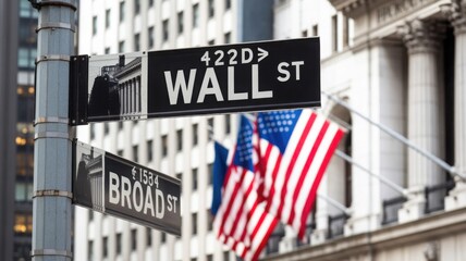 A Wall Street street sign, with the American flag in the background. The sign is in a urban area. The image captured the intersection of business and patriotism