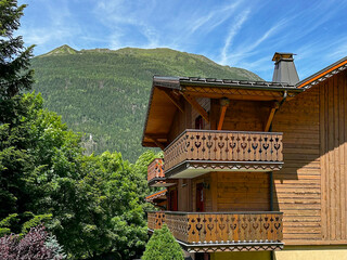 Lush Mountains And French Architecture