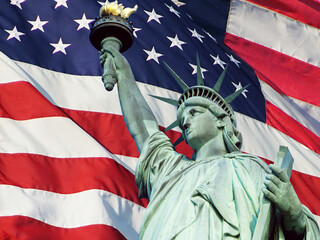 Statue of Liberty in Front of an American Flag