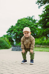 Fototapeta premium Little explorer ready for adventure in a serene park setting during a bright day