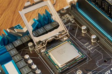 Fototapeta premium Chelyabinsk, Russia - January 23, 2021: Motherboard processor shot from above, close-up of processor