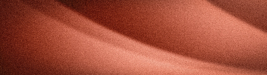 Fototapeta premium Warm wide abstract gradient in rich metallic copper and deep terracotta hues, featuring a distinctive grainy texture and flowing wavy shadows. Ideal 4K backdrop template